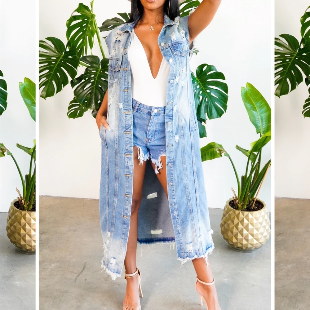 Distressed long denim jacket.
